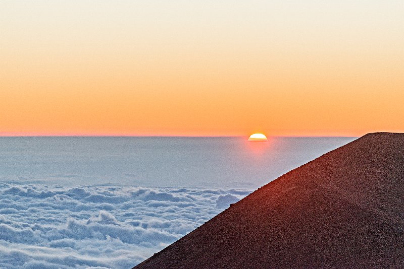 20140109_180551 D800-Edit.jpg - Sunset atop Mauna Kea.  Its uniqueness is that the sun is 'falling' into the clouds